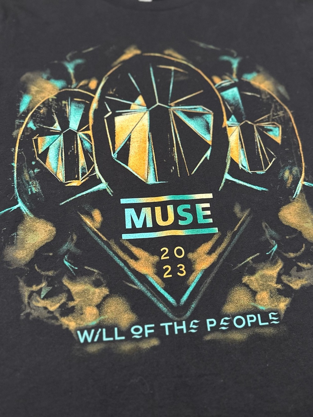 Muse Black Tee with Teal and Gold Graphic